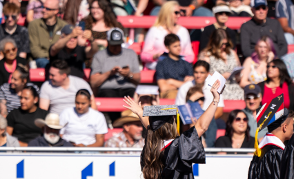 crowd in stands at commencement ceremony