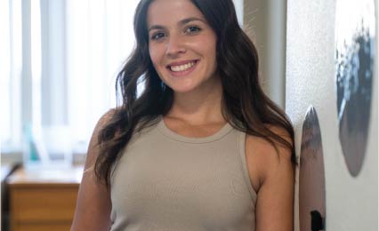 resident smiling at camera from room
