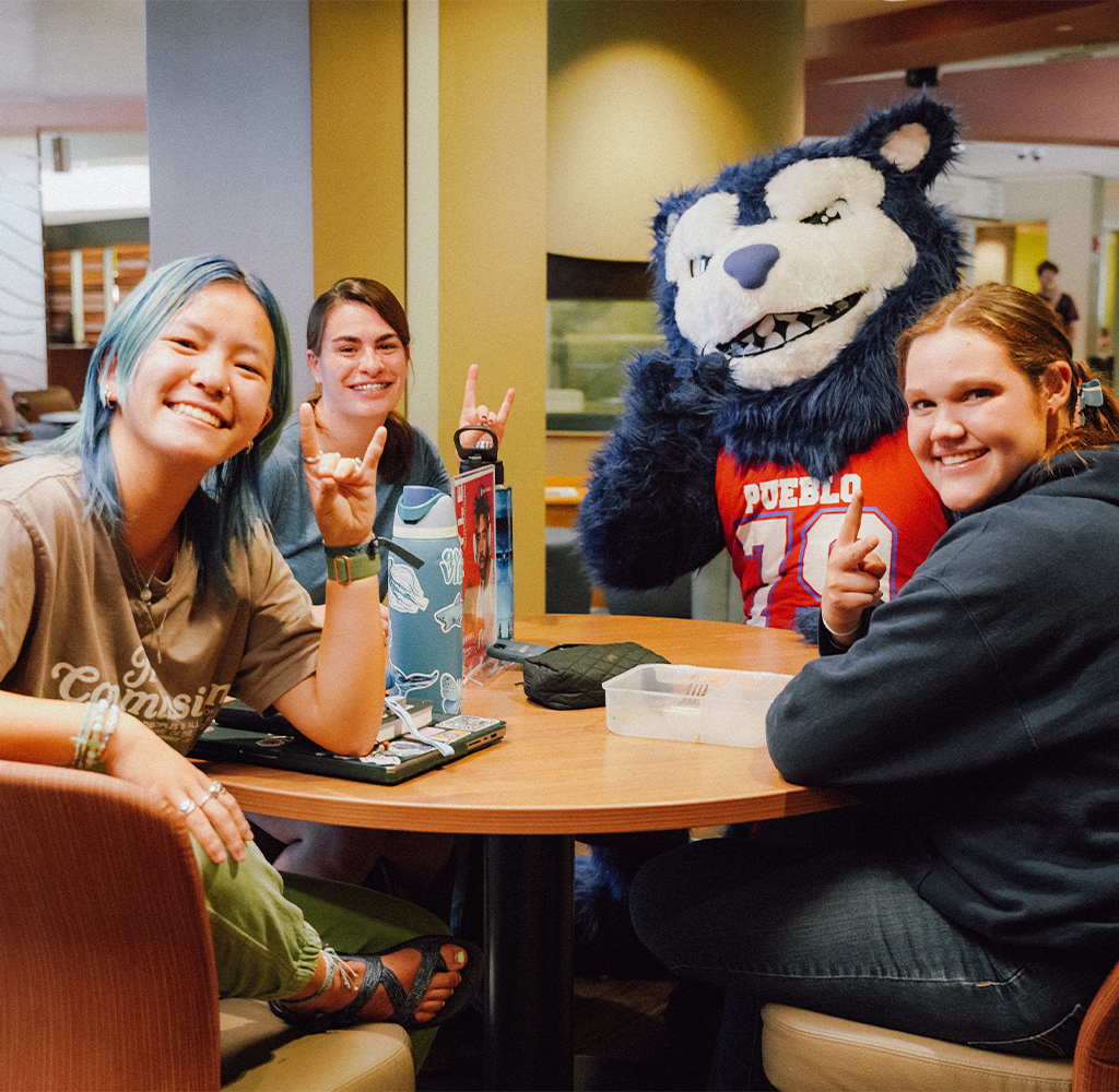 CSU Pueblo students with Wolfie mascot