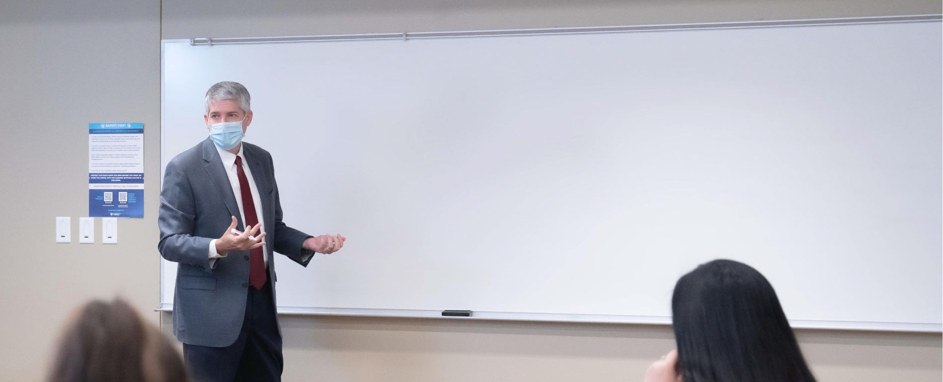 professor with mask teaching lecture