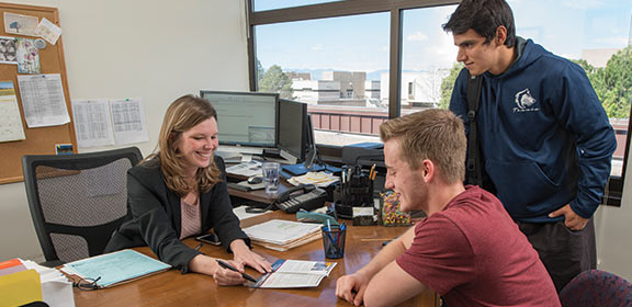 Students meeting with their academic advisor