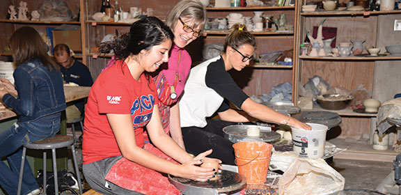 Colorado State University-Pueblo student working on pottery