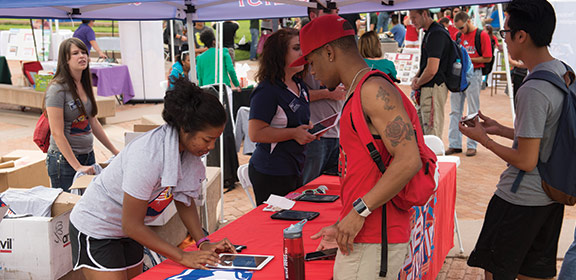 Students in line getting free shirts at Welcome Week