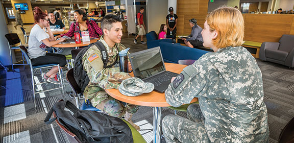 Military students conversing in the Library and Academic Resource Center