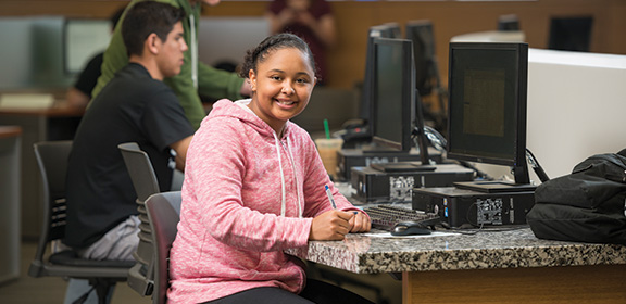 Students working on homework in the CSU-P library