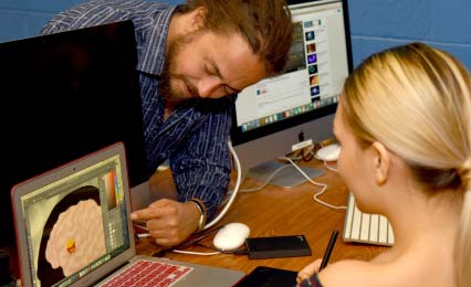 Professor talking with student