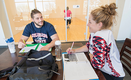 Two students working in rec center