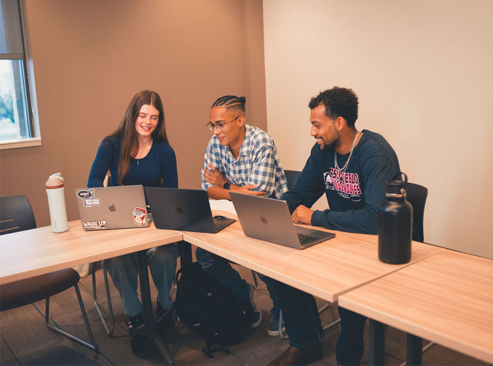 Students collaborating and learning at the Hasan School of Business