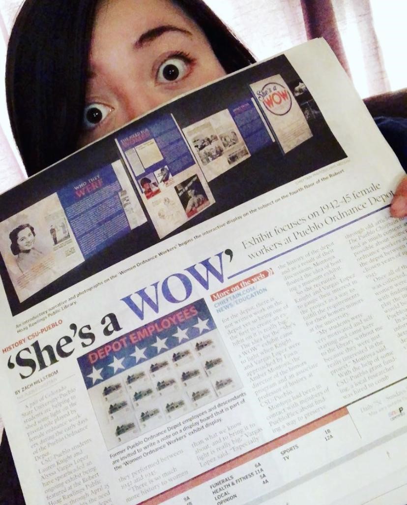 Alyssa with a newspaper article