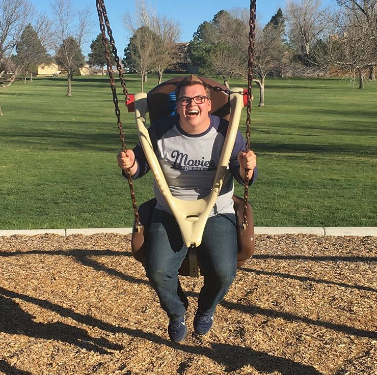 Daniel sitting in a swing