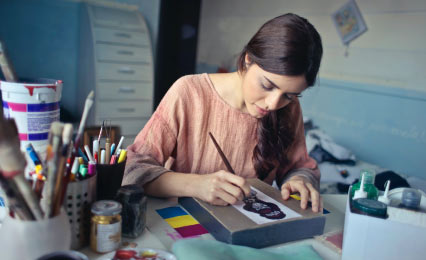 student painting in art studio