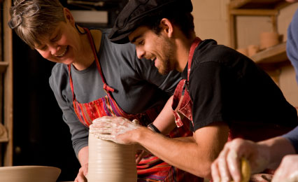 professor and student in ceramics studio