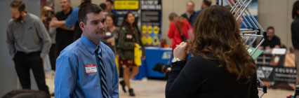 Professionally dressed student at career fair