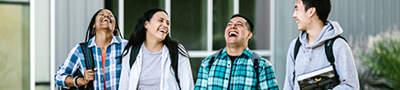 group of people walking and smiling