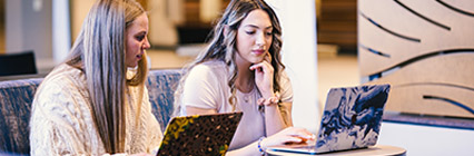 two students on laptops