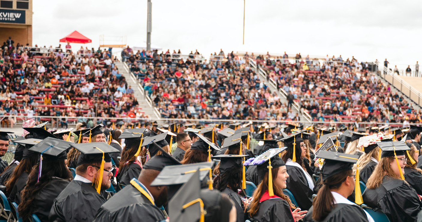 crowd in stands at commencement ceremony