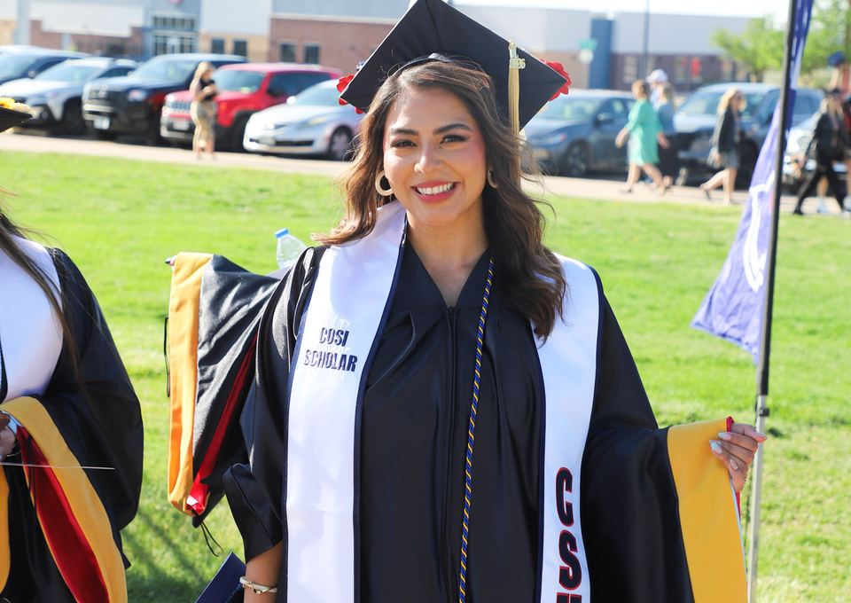 CSU Pueblo graduate smiling at commencement