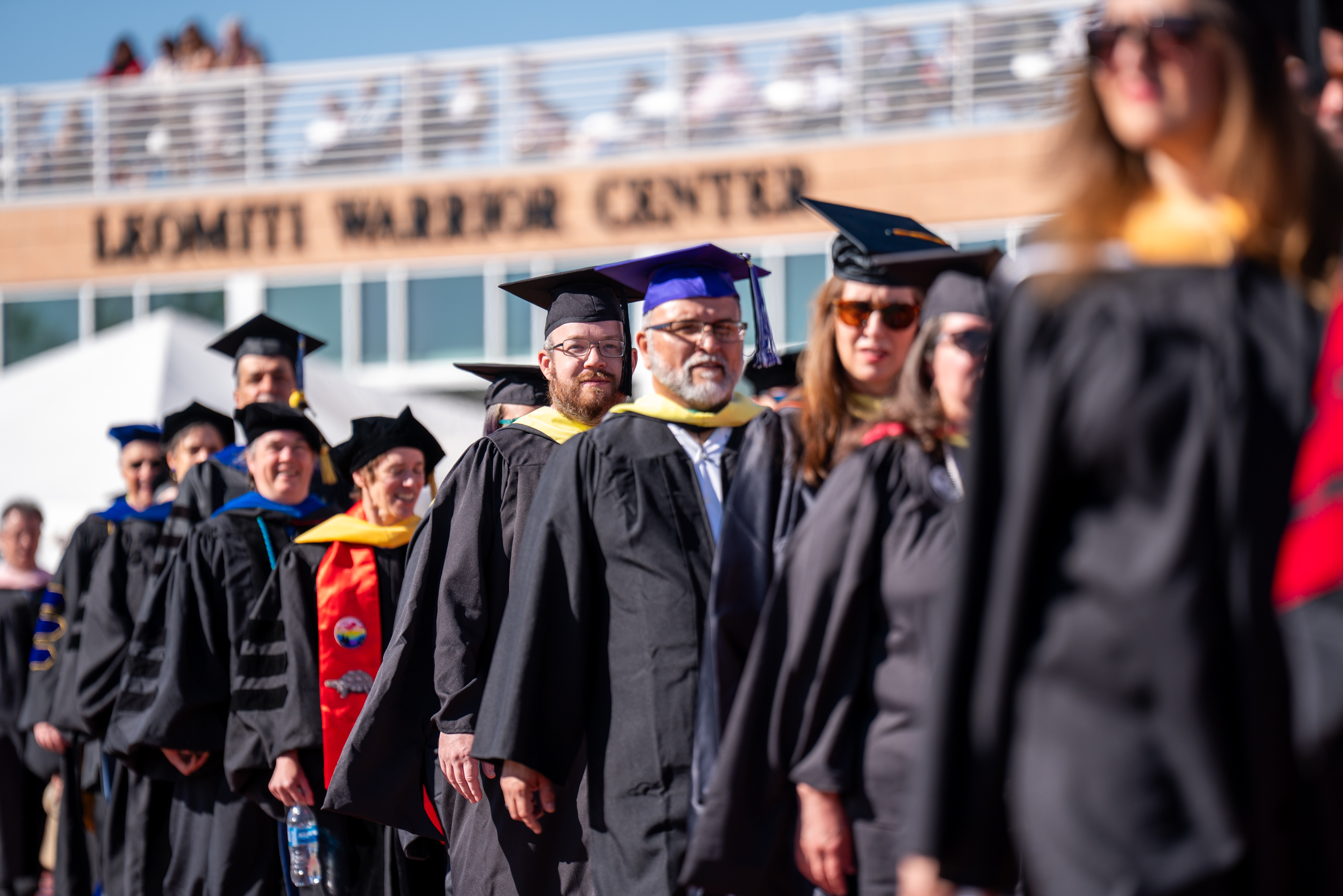CSU Pueblo graduates celebrating at commencement