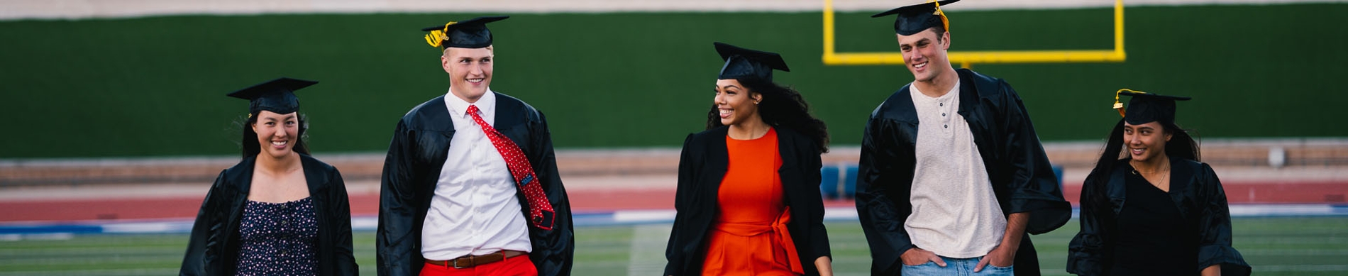 grads walking and smiling