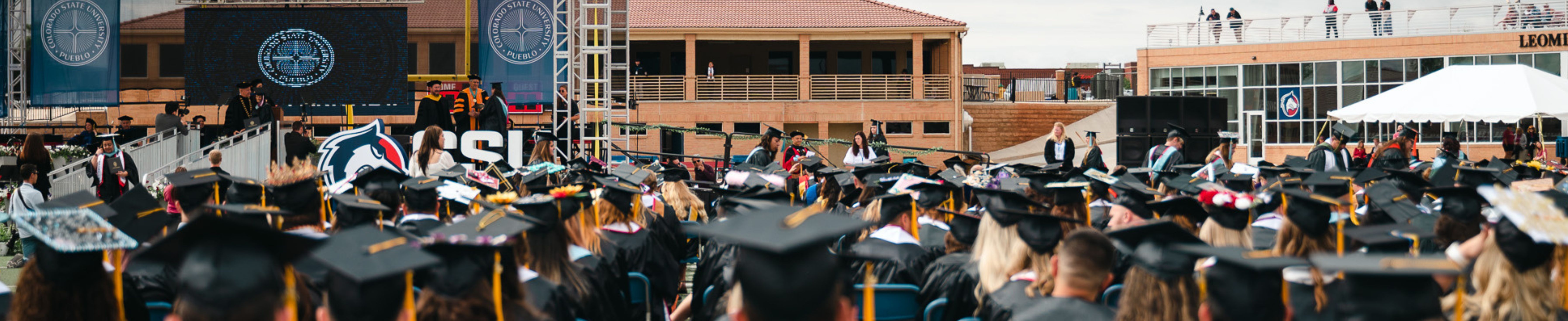 view of graduates and stage at commencement ceremony