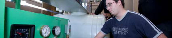 Student looking at meter
