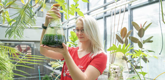 high school student in chemistry lab