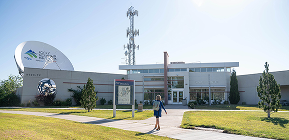 woman walking on campus