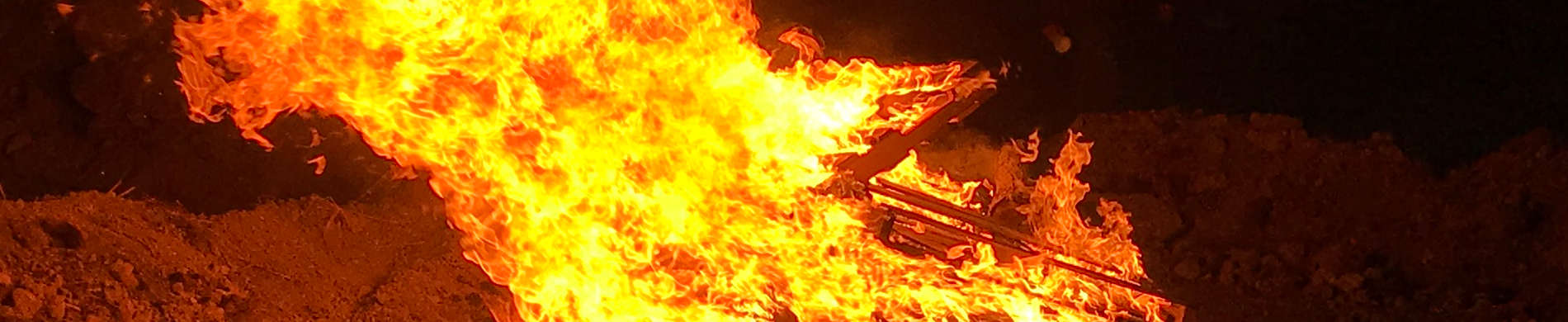 Homecoming Bonfire burning brightly at night