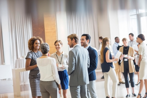 Students networking in a room