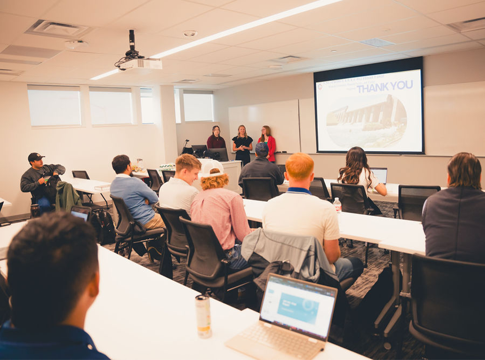 Students learning together in a Hasan School of Business classroom