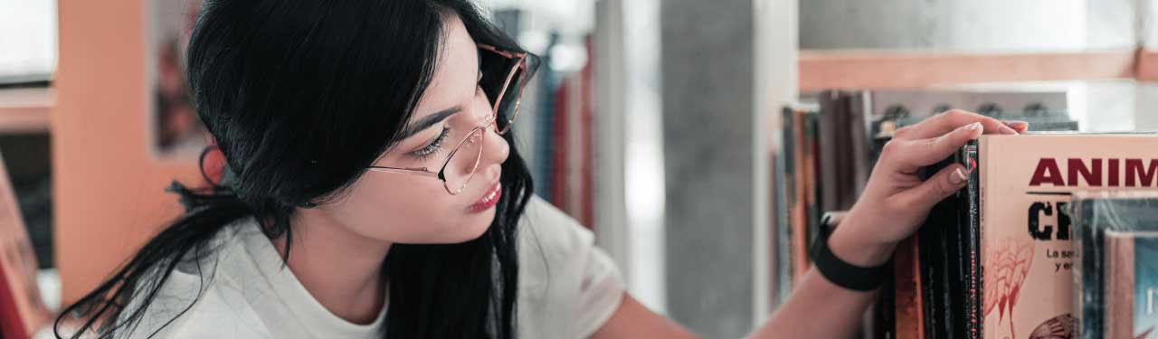 Student looking at books