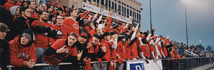 football game with students cheering