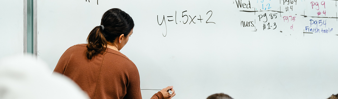 Hands of solving math problem 