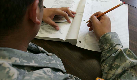 Soldier writing homework