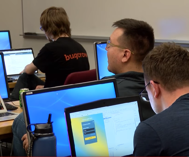 Students of the cybersecurity workshop working in computer lab
