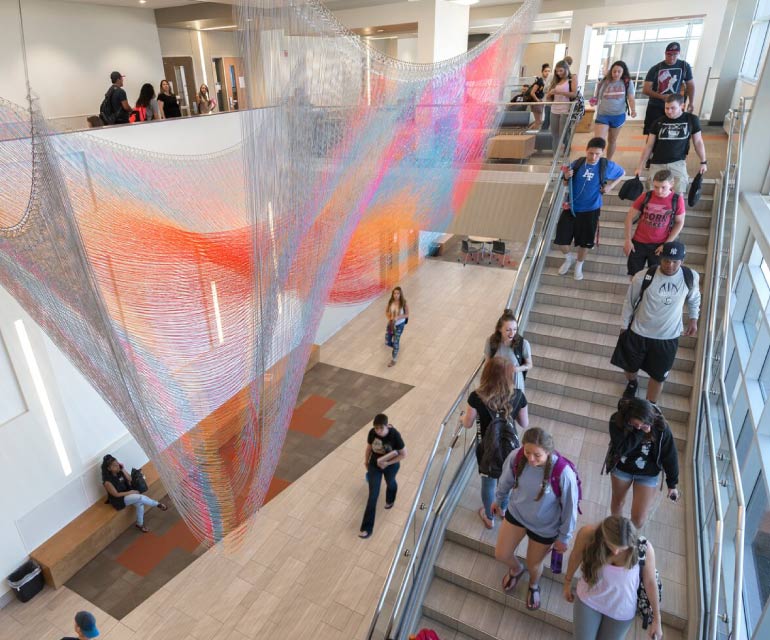 Students walking in GCB building