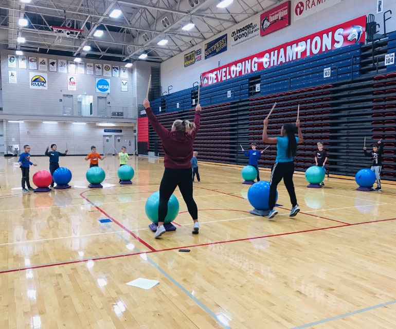 Students in Massari Arena teaching physical education