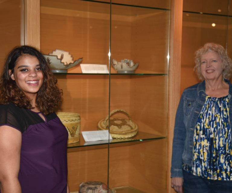 Bryana Owens and Bev Allen in front of Archives