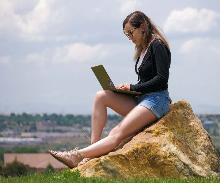 Csup student on laptop