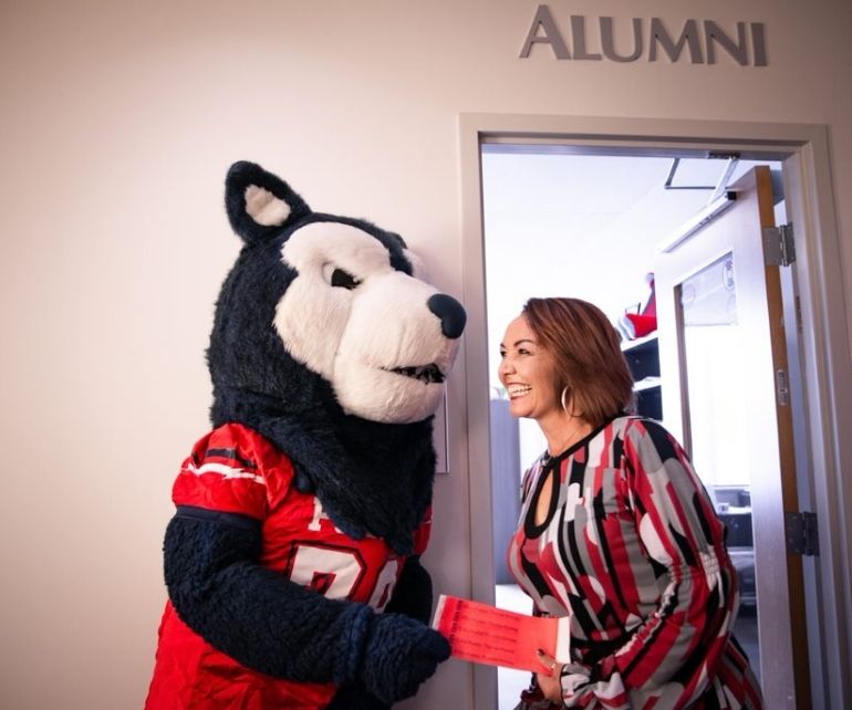 Wolfie and Tracy Samora share a smile at the Alumni Office