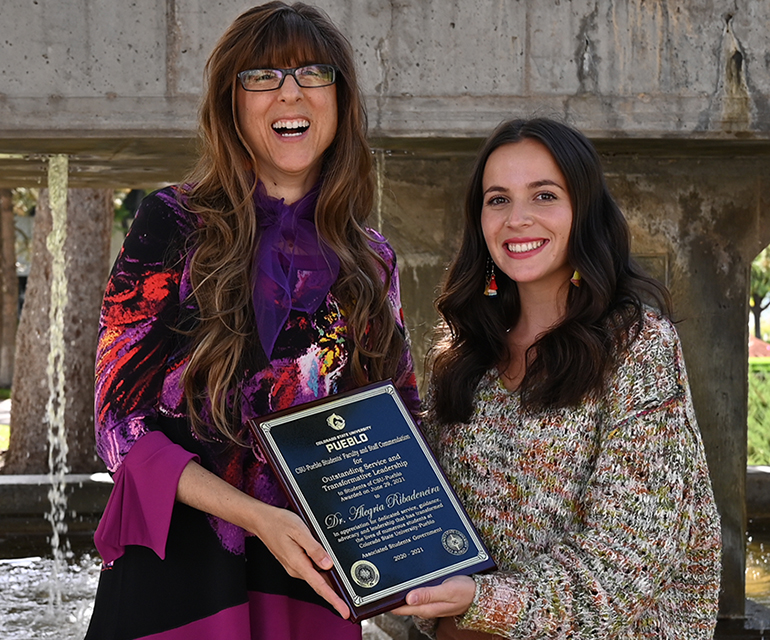 Alegria Ribadeneira is presented the Students Choice Award for Faculty