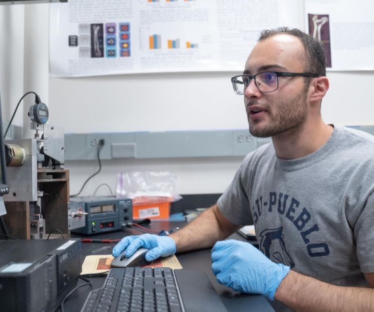 Student in lab on campus