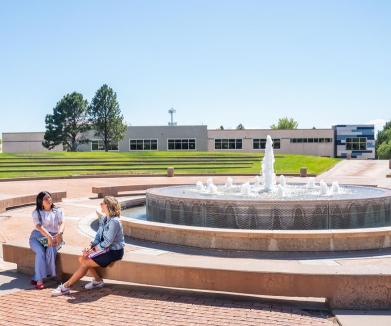 Victoria Obregon and Gena Alfonso outside at the CSU Pueblo Fountain