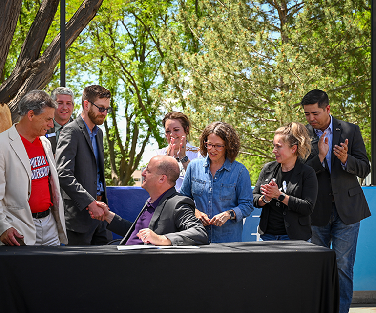 Gov. Jared Polis signing two bills