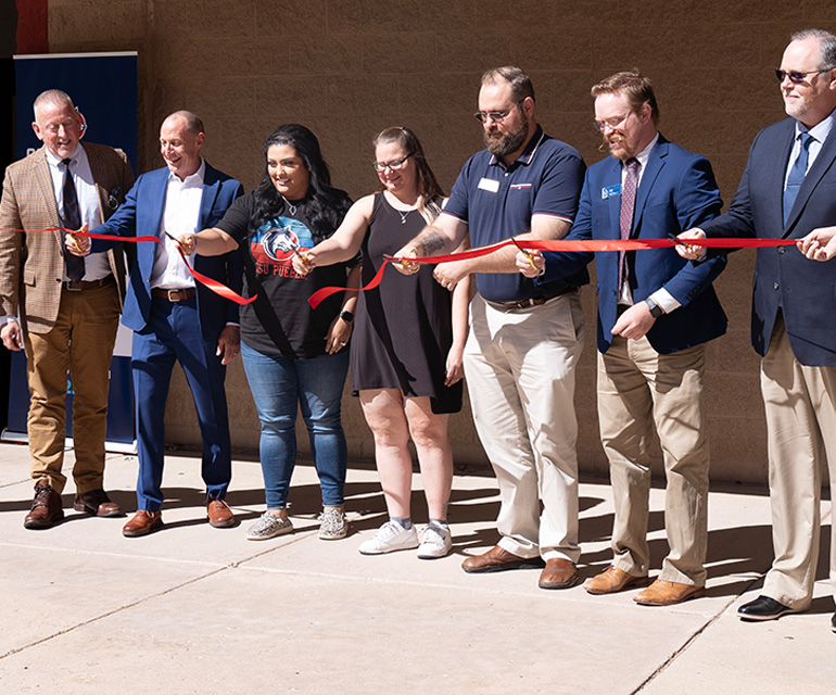 people cutting ribbons at the new pikes peak center