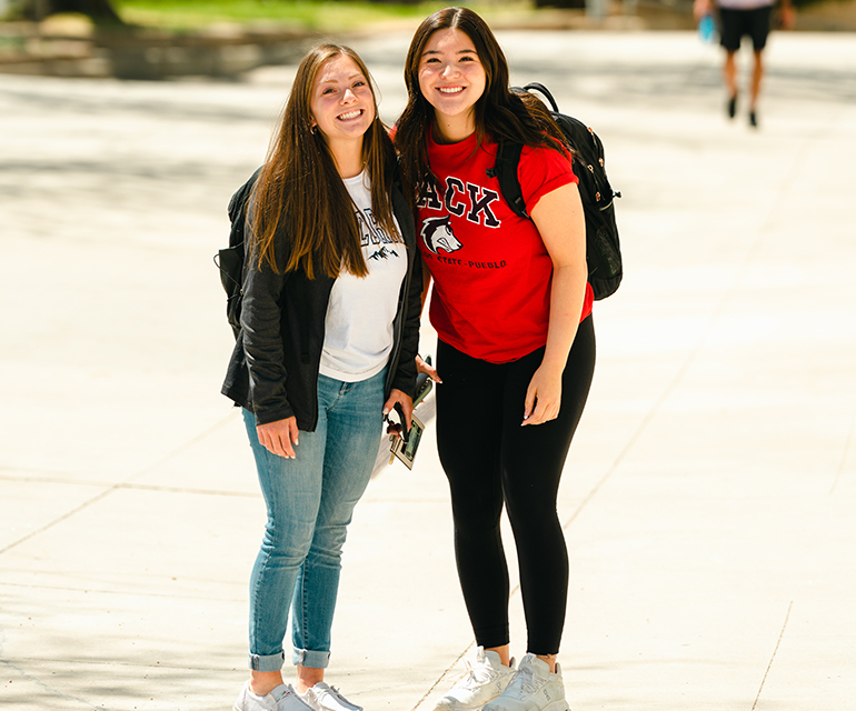 two students smiling