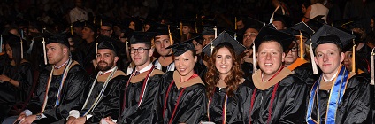 Graduates smiling during commencement