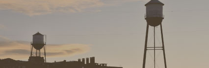 water towers in pueblo during sunset
