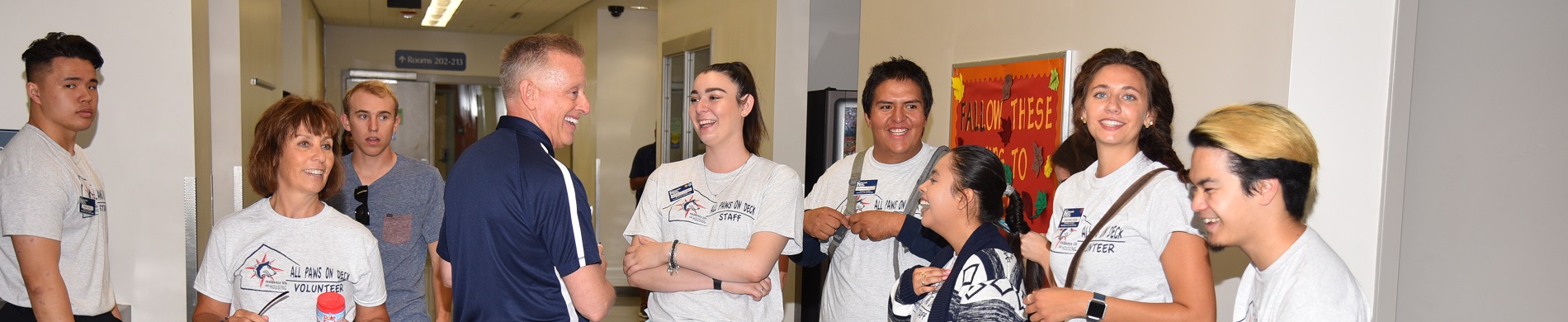 President Mottet laughing with students in Residence Halls
