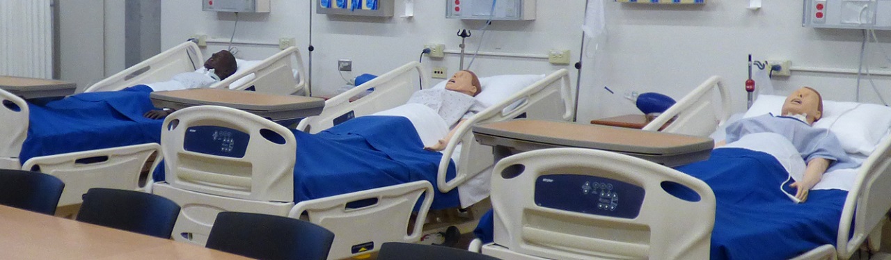 Dummies sitting in hospital beds